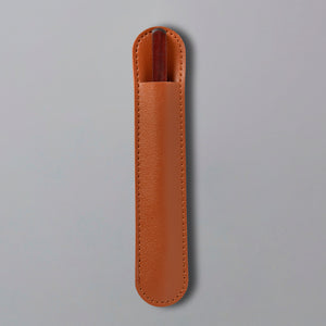 Tea Knife Hugo in brown leather protective sheath with stitched edges against gray background