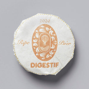 2020 DIGESTIF shou puer tea cake with orange floral logo design on white wrapper with yellow stitched edge