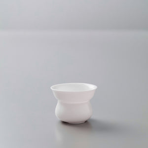 Elegant white porcelain filter stand for tea preparation, part of the PORCELAIN FILTER set on minimalist grey background