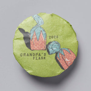 Grandpas Flask 2020 huangpian puer tea cake with illustrated flask design on green wrapper