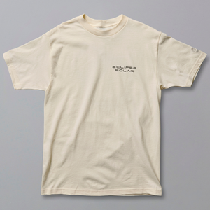 An off-white short-sleeve crewneck t-shirt with black Japanese text printed on the left chest, displayed flat against a solid gray background.