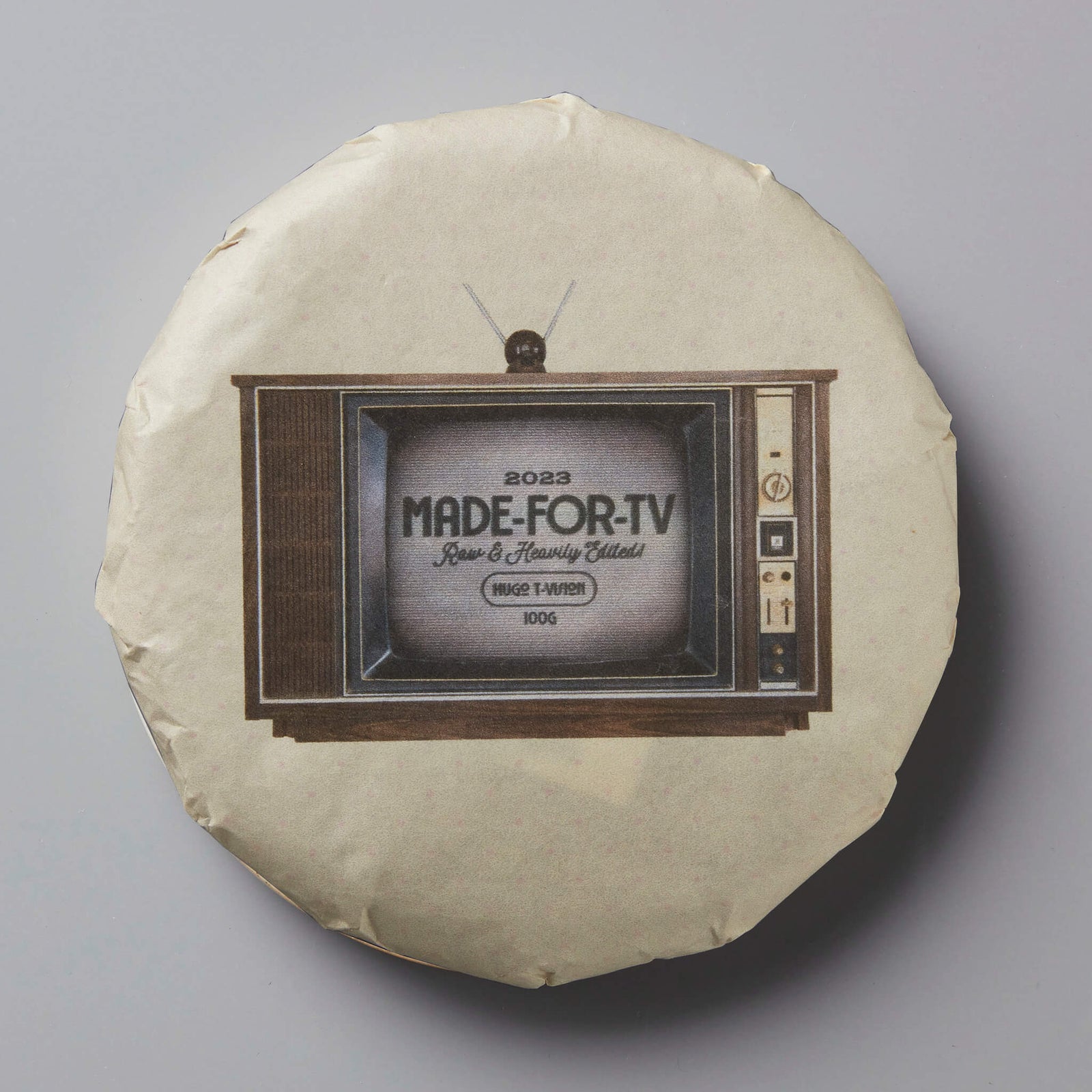 MADE-FOR-TV sheng puer tea cake with vintage TV design wrapper showing retro television set against cream background