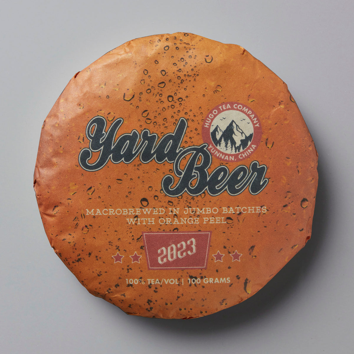 2023 Yard Beer tea cake with orange textured wrapper and mountain logo on terracotta colored packaging