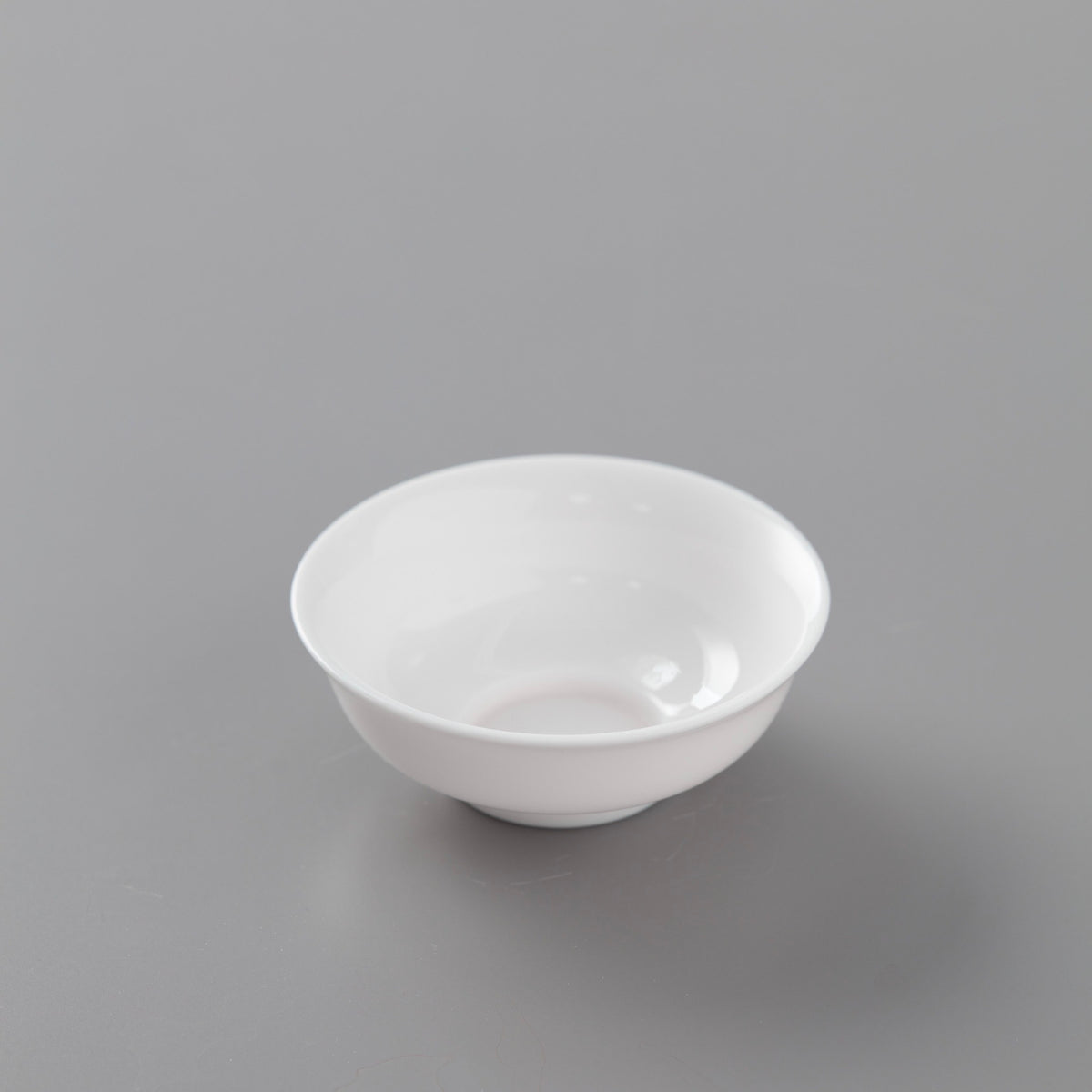 White porcelain filter stand, round bowl-shaped design with glossy finish for tea straining